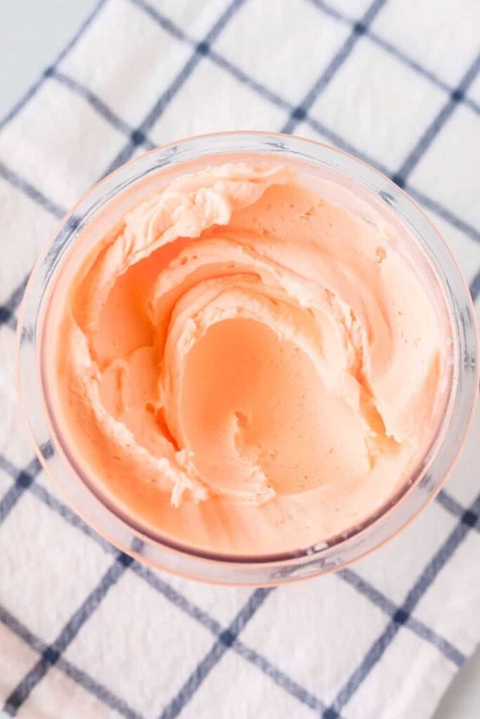 a bowl of orange soda ice cream