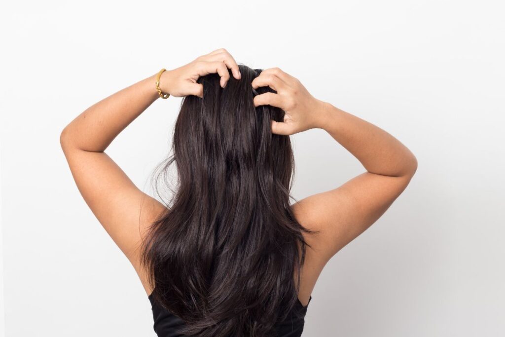 a girl grabbing her hair