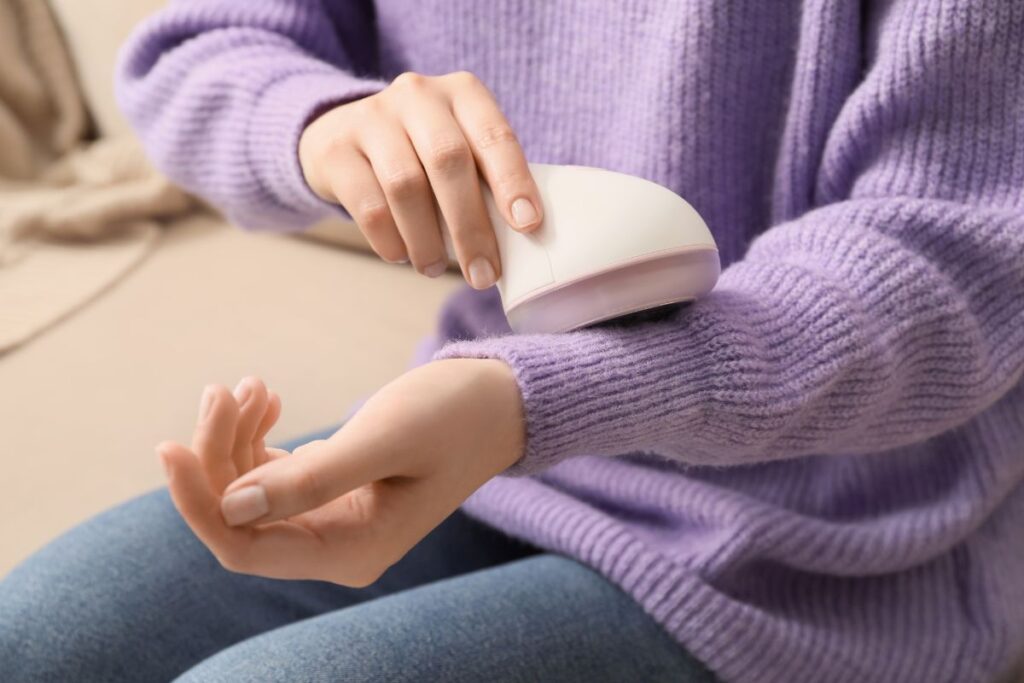 a woman shaving her sweater